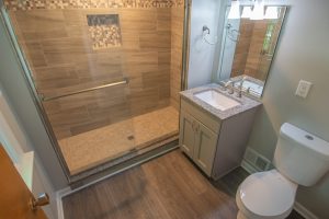 Traditional Style Bethel Park Bathroom in Warm Tones Accented by Using Mosaic Tile on Floor and Walls.